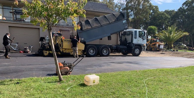 This is a photo of an asphalt driveway which is in the process of being installed by Labrador Surfacing Solutions