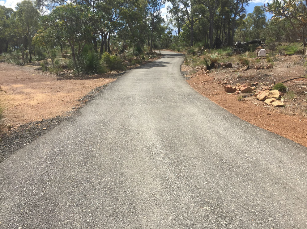 This is a photo of a hot spray & seal bitumen driveway which is in the process of being installed byLabrador Surfacing Solutions